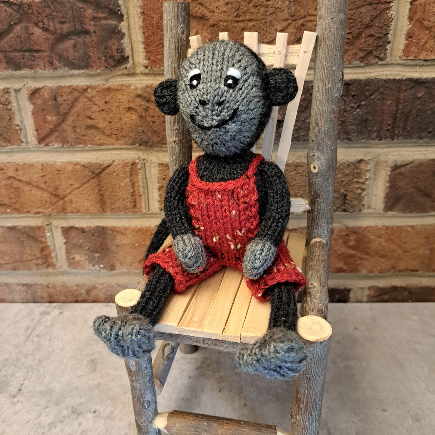 Handknit Monkey Toy - dark gray with red short overalls