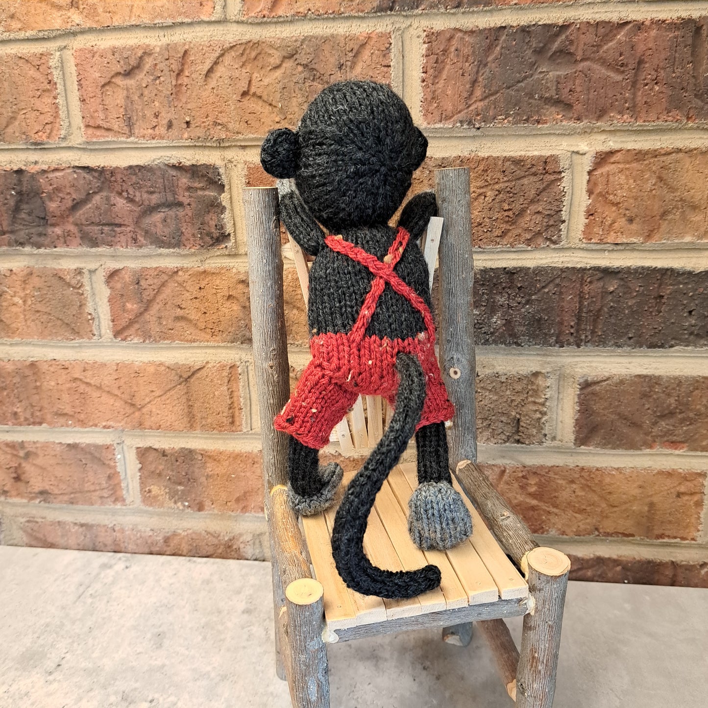 Handknit Monkey Toy - dark gray with red short overalls