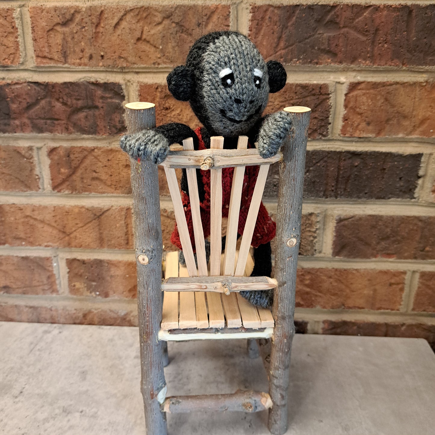 Handknit Monkey Toy - dark gray with red short overalls