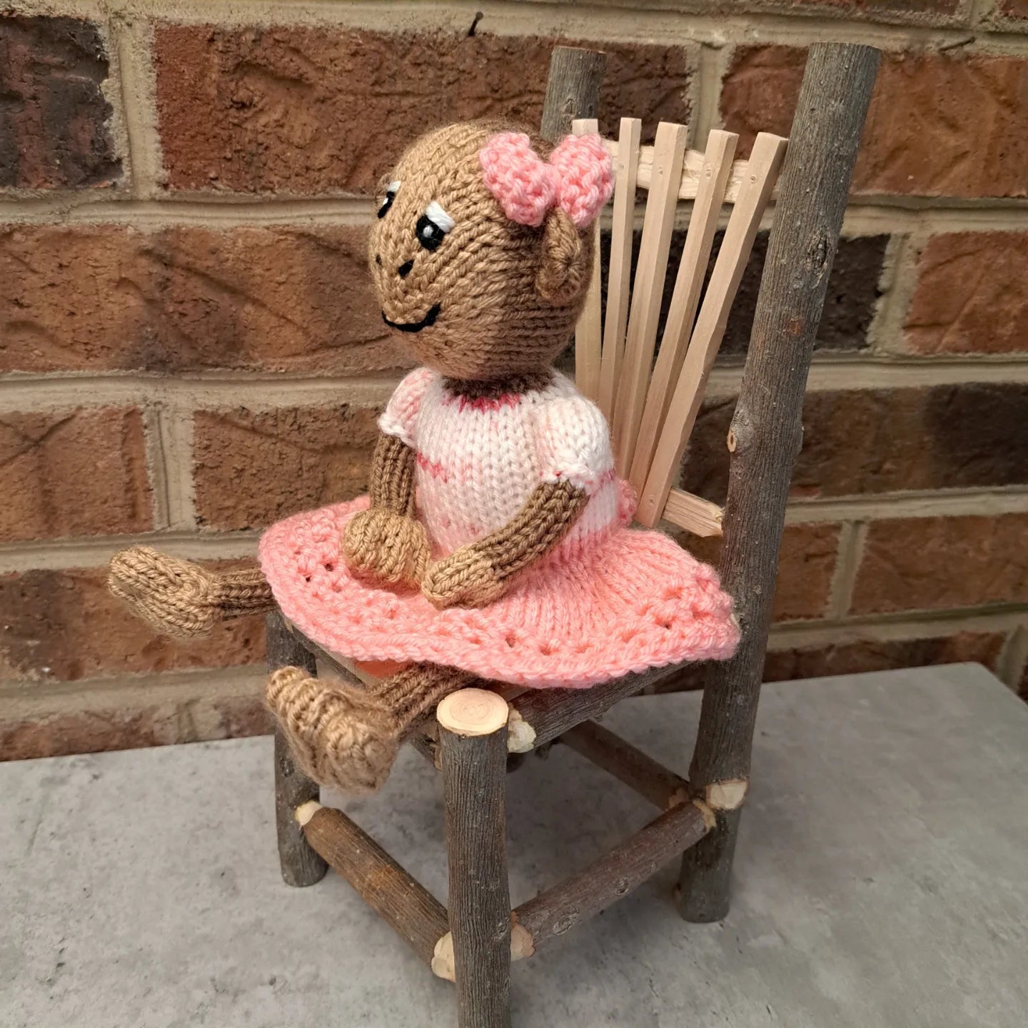 Handknit Monkey Toy - light brown with pink skirt and top