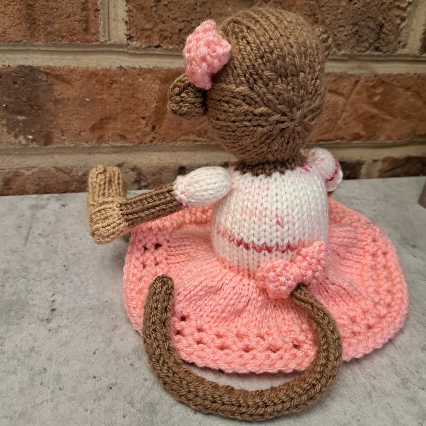 Handknit Monkey Toy - light brown with pink skirt and top