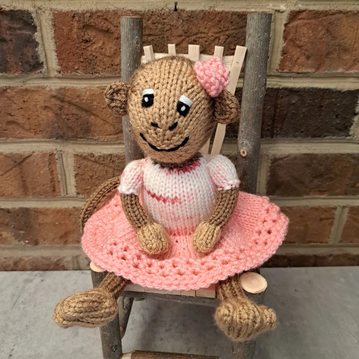 Handknit Monkey Toy - light brown with pink skirt and top